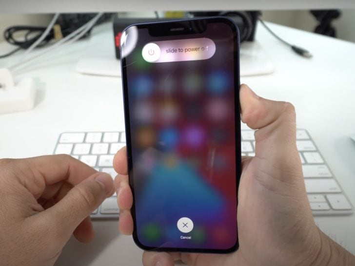 Photo of person resetting iphone