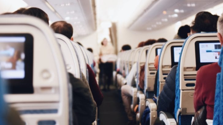 Photo of airplane cabin with in flight entertainment