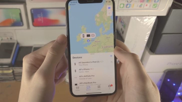 Photo of person using find my app in iphone