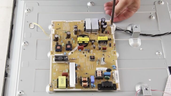 Photo of person removing vizio tv power supply