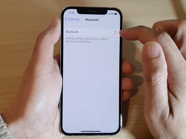 Photo of person turning off bluetooth in phone