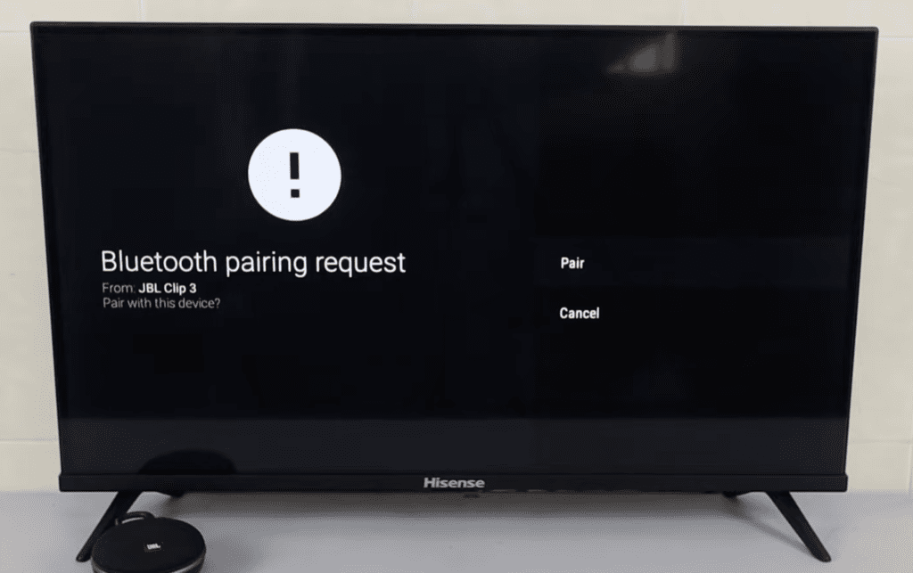 Photo of a Hisense TV and a Bluetooth speaker pairing