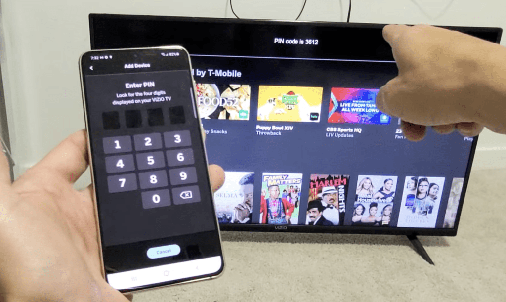 Photo of person pairing a Vizio TV with the Vizio Mobile app