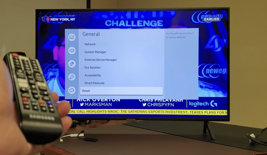 Photo of person performing a factory reset on a samsung tv