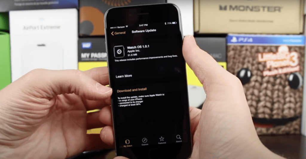 Man pointing to install the watchOS update using the iPhone