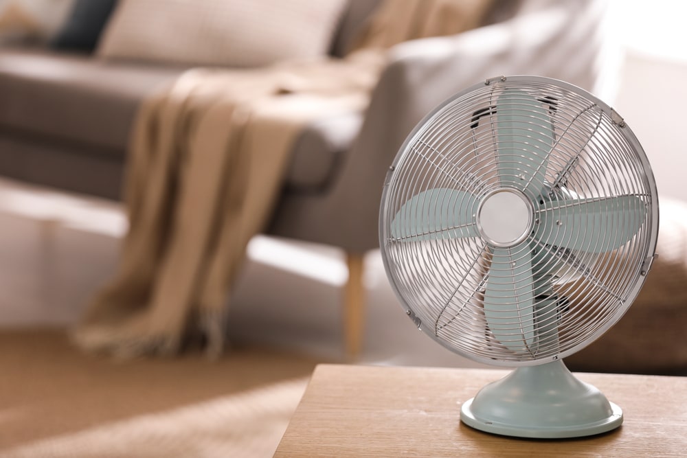 an electric fan on a table