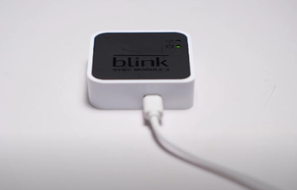a Sync Module on a white table