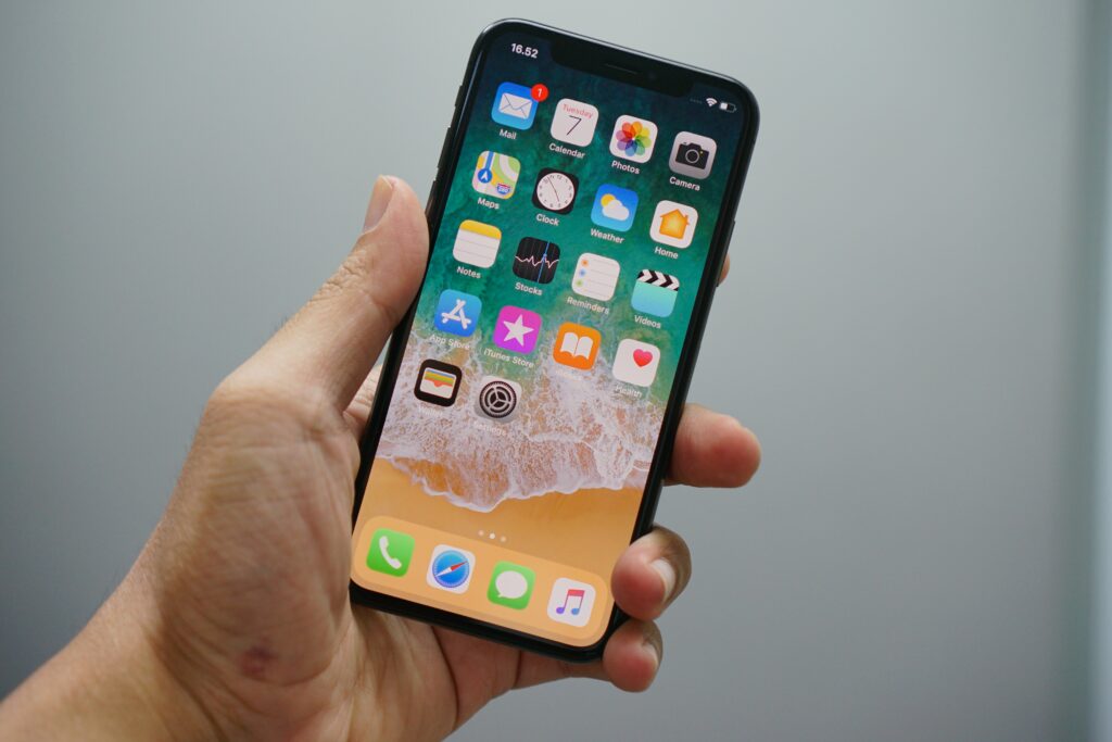 iPhone held in white background