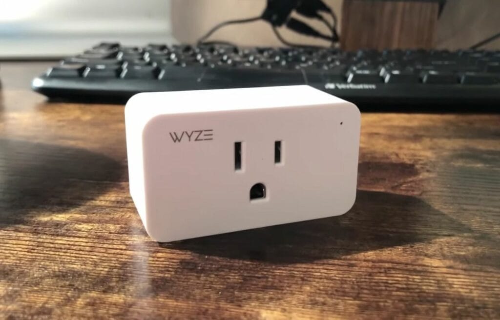 A Wyze plug on a wooden table