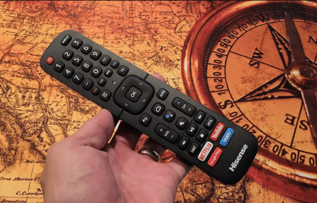 hand holding a Hisense TV remote 