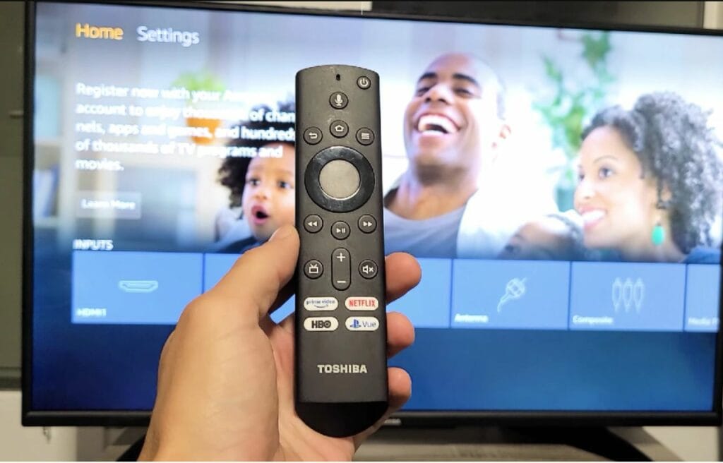 Holding a Toshiba Fire TV remote