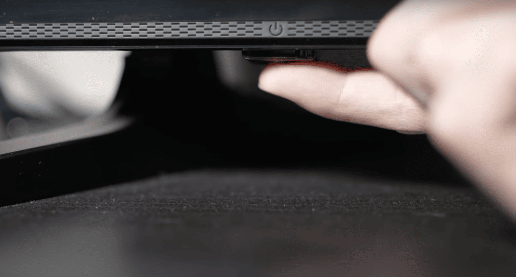 Holding down the power button of the Toshiba TV