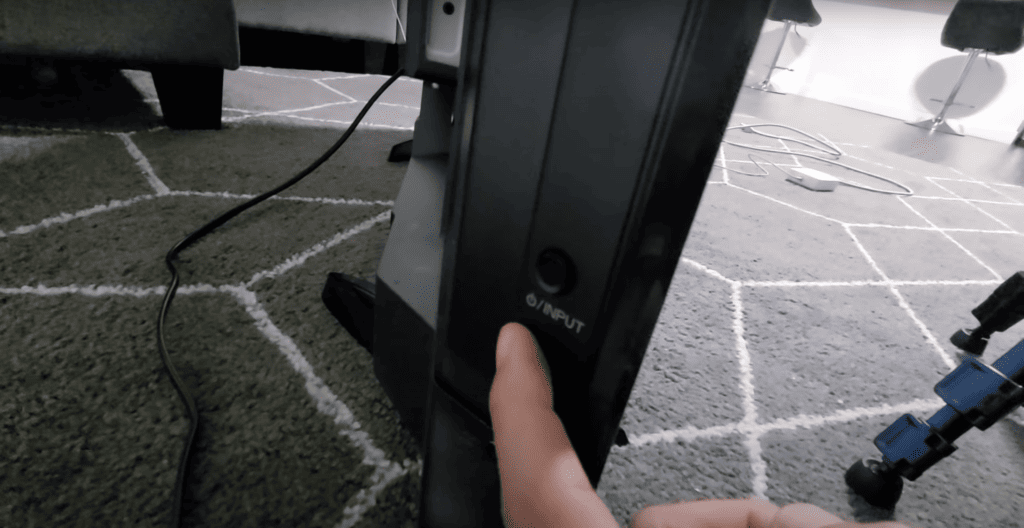 Power button at the side of the TV