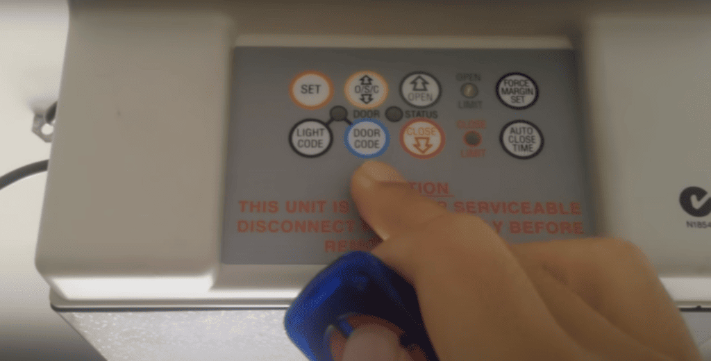 Pressing the garage door button
