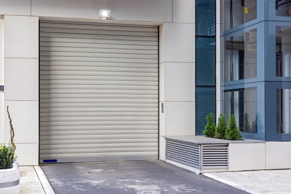 Garage door with reflector on top of it