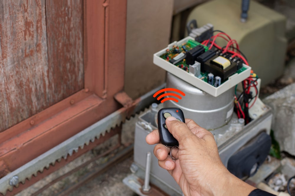 Technician checking the garage sensor using remote